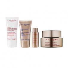 Set for the person Clarins Nutri-Lumiere Collection (day cream, 50 ml + night cream of 15 ml + lotion, 10 ml + hand cream, 30 ml + a make-up bag)