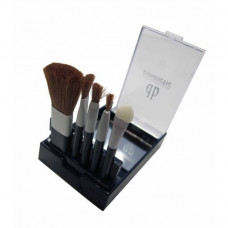 A set of brushes with db cosmetic mirror